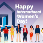 Women standing in front of an outline of a house.