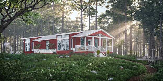 A manufactured new home in a woodland setting with sunlight streaming through the trees. 