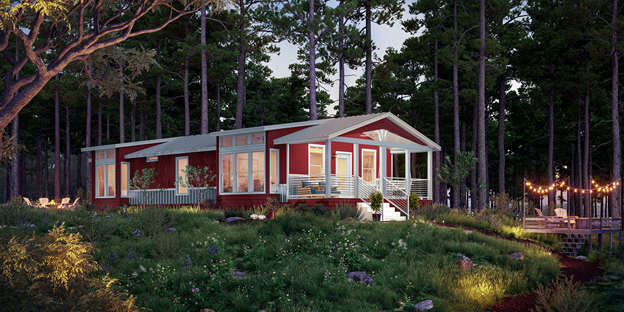 A manufactured new home in a woodland setting at dusk.