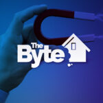 A close-up of a person holding a magnet with the BYTE logo in front of it.