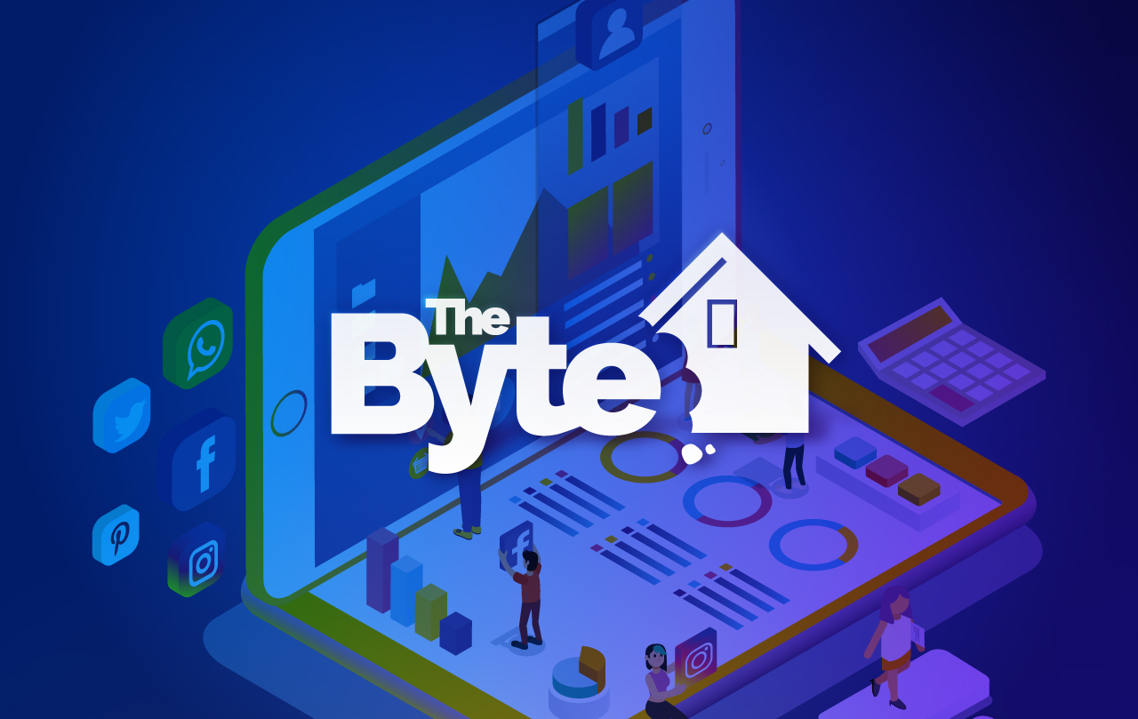 A group of people standing in front of a tablet with the BYTE logo over it.