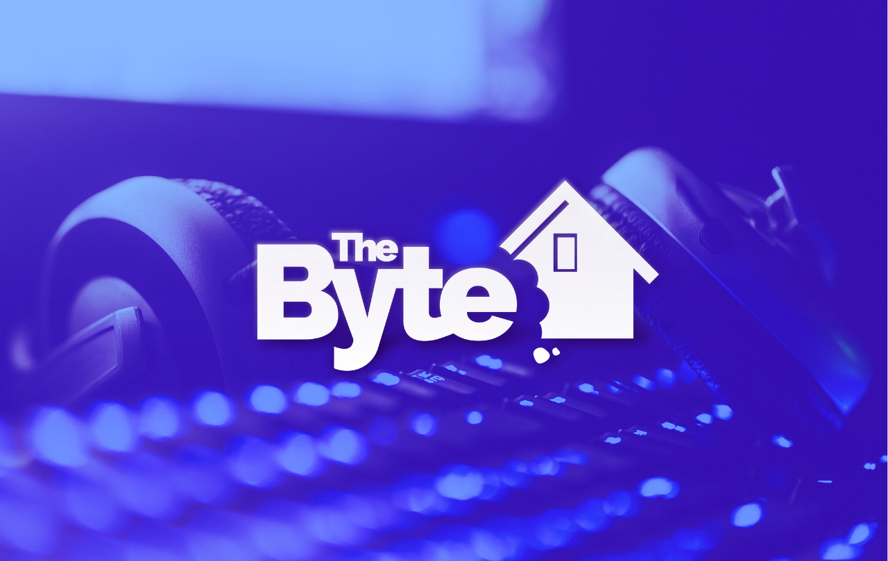 A image of pair of headphones laying on a keyboard with the computer screen lit it the background. A blue overlay and the BYTE logo are over the image.