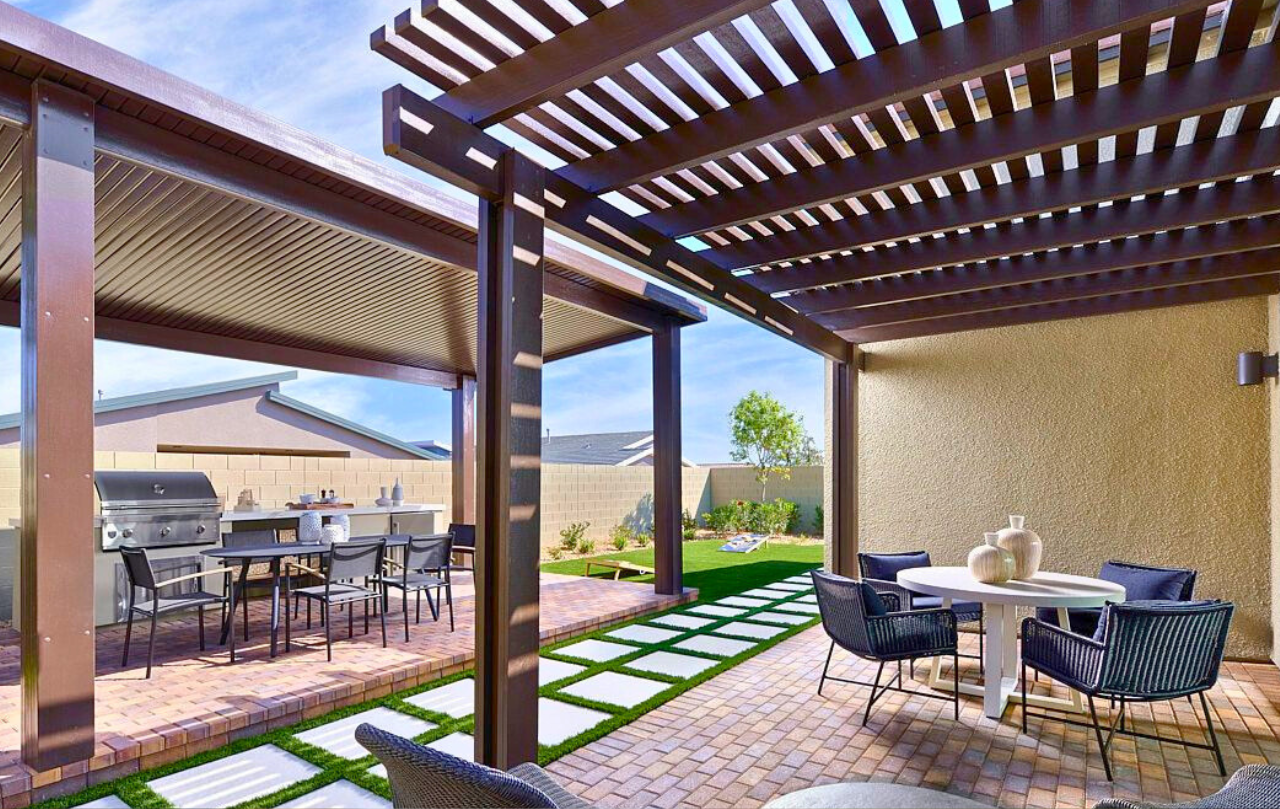 A rendering of an outdoor patio and backyard.